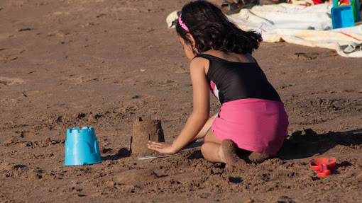 Child Playing in Sand